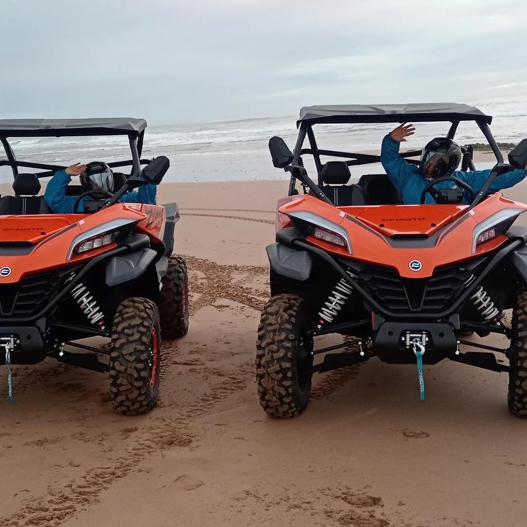 Buggy driving Atlantic shoreline near Essaouira — dunes and ocean scenery
