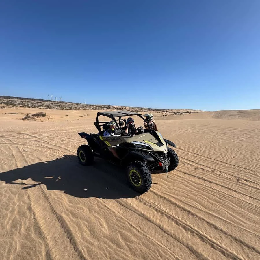 Can-Am buggy on Atlantic sand near Essaouira — rent buggy dunes adventure
